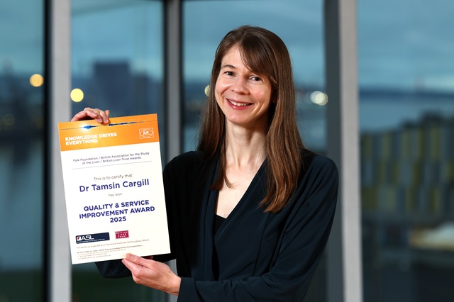 Dr Tamsin Cargill holds her certificate