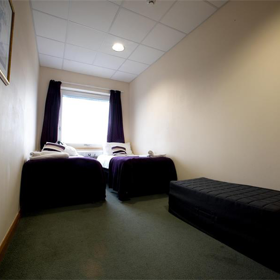 Small bedroom with two single beds.