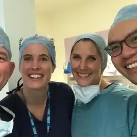 Four clinicans, smiling.