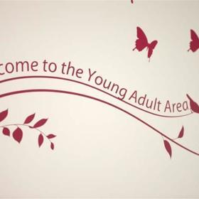 Pink wall art of branches, birds and butterflies. Text reads 'Welcome to the Young Adult Area'.