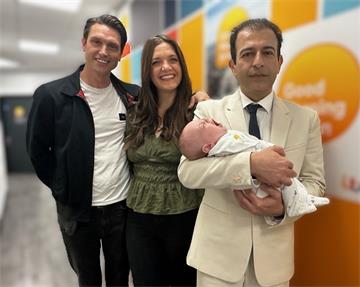 From left: Adam, Lucy, and Mr Hooman Soleymani Majd holding Rafferty Isaac