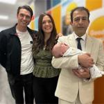 From left: Adam, Lucy, and Mr Hooman Soleymani Majd holding Rafferty Isaac