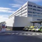 Exterior view of John Radcliffe Hospital Emergency Department with ambulances parked in front