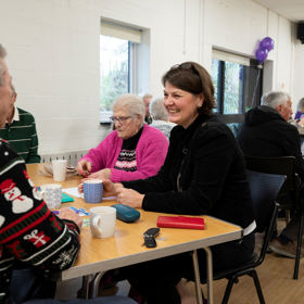 Some attendees sat at a table, talking