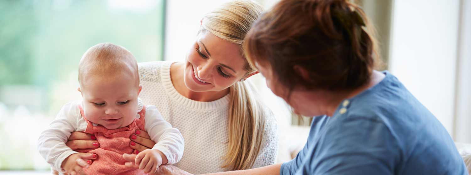 Healthcare professional with woman and baby