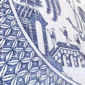 Close up of blue and white ceramic mural.