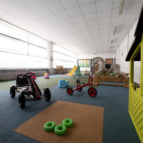 A room with children's toys and a playhouse.